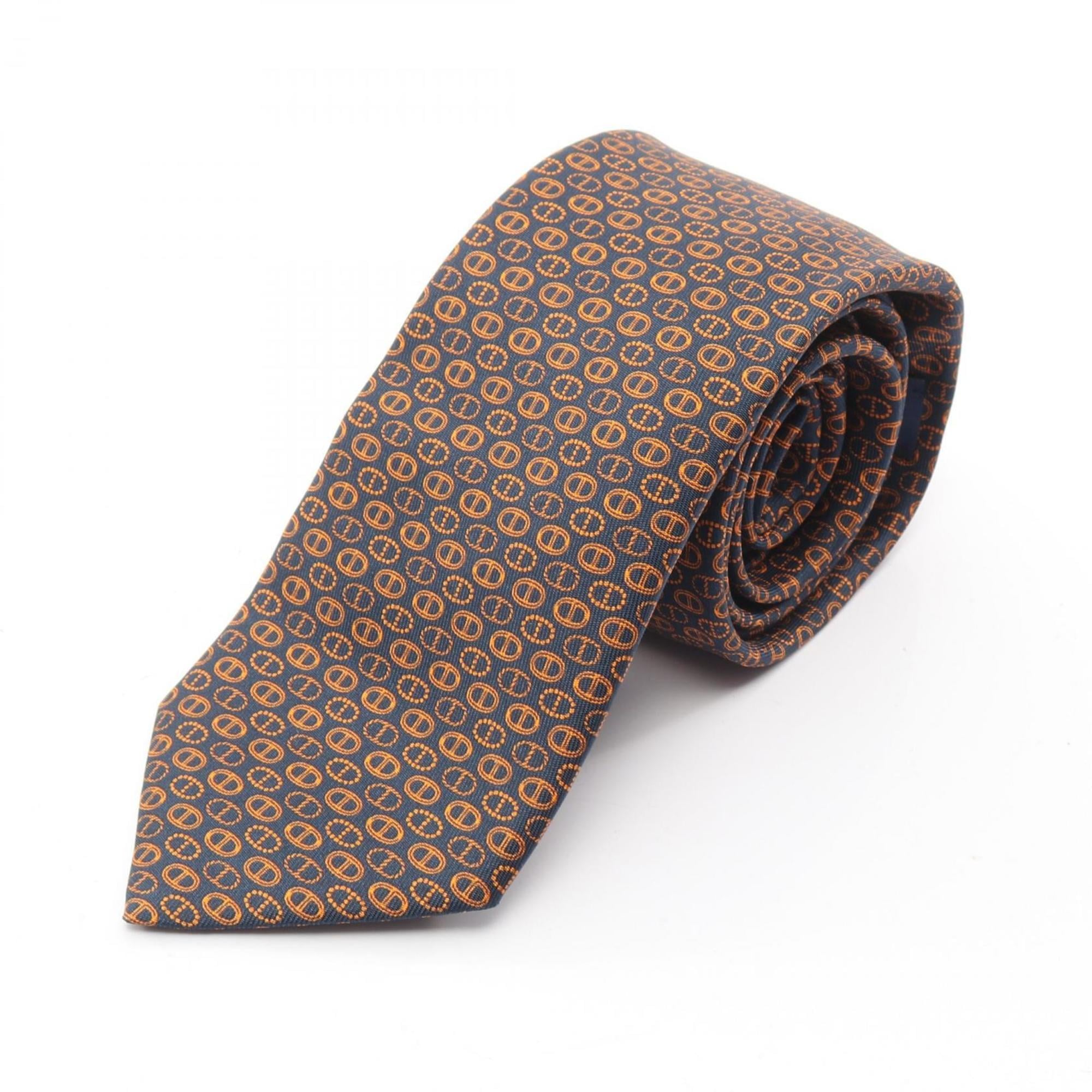 Hermes HermÃ¨s Maillons Parade Chaine d’Ancre silk tie for men in navy and orange.