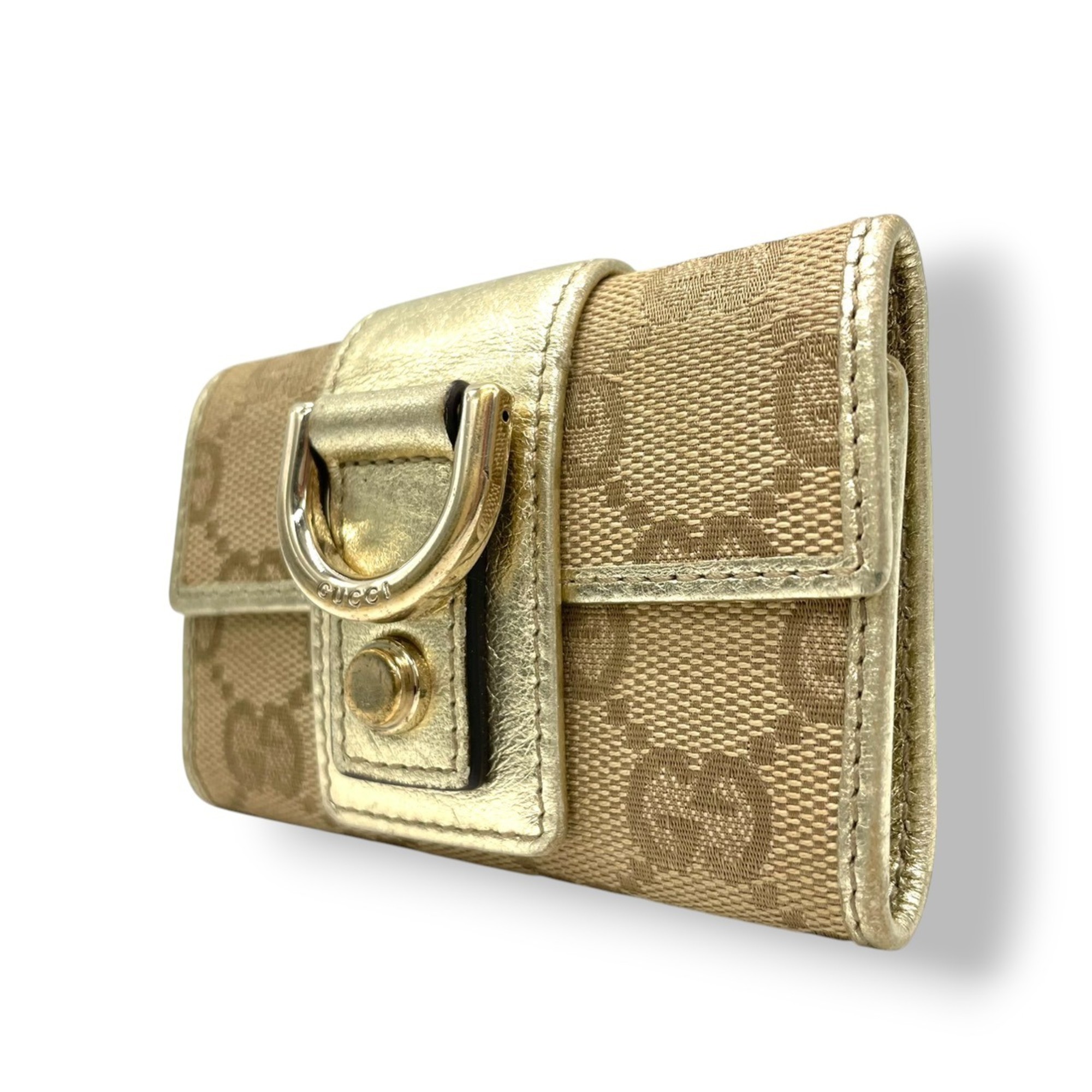 Gucci 5-ring key case in GG canvas and leather with Abbey D-rings, available beige, brown, gold. Compact size, w5.