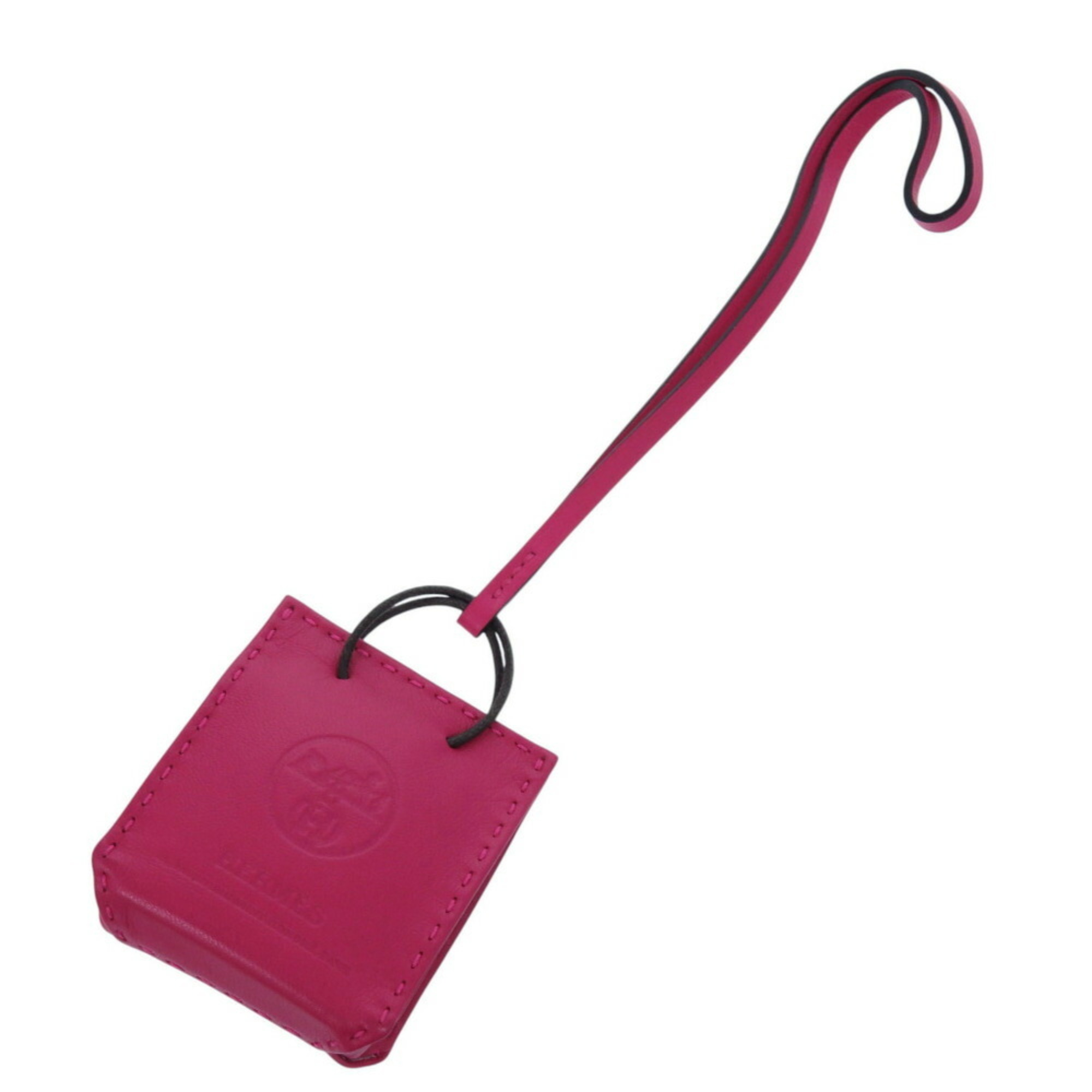 Like new HermÃ¨s Sac Orange bag charm in lambskin with a Y stamp and pink keychain. 0459HERMES